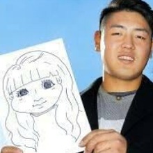 岡本和真選手がお嫁さんの似顔絵を持っている写真画像